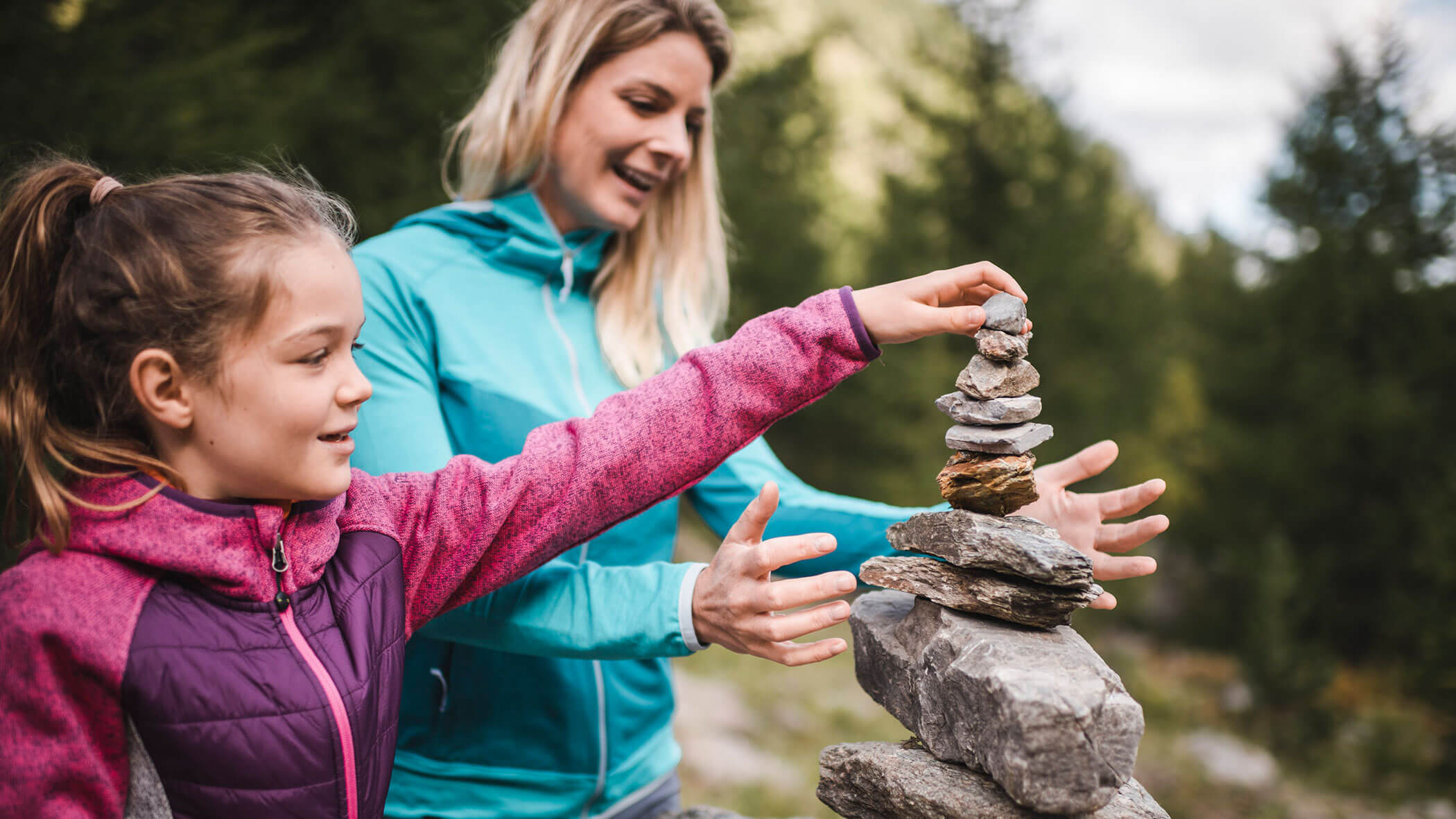 Child builds a stone tower