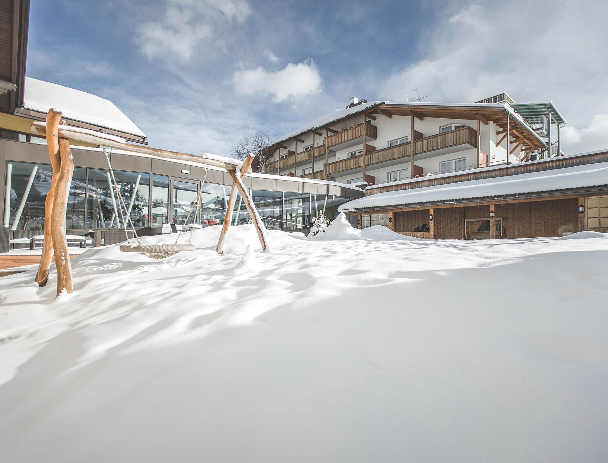 Snow-covered playground in winter - Hotel Fameli