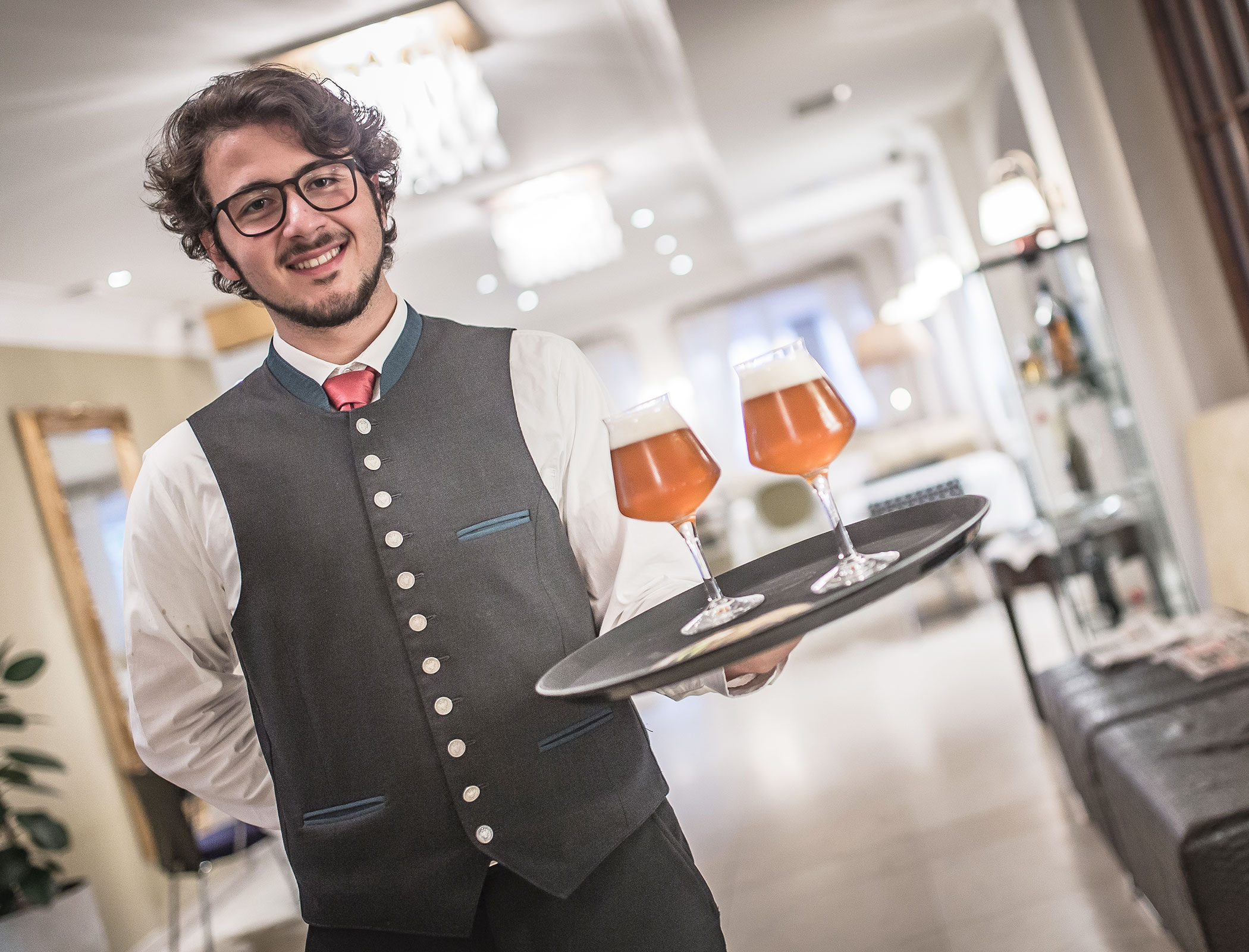 Bartender serves beer - Hotel Fameli